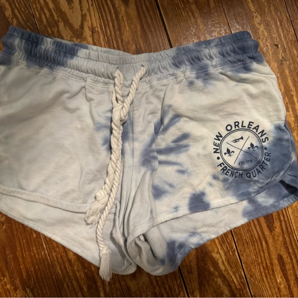 Blue tie dye New Orleans logo shorts, these are junior size L like a women’s XS - Picture 1 of 4